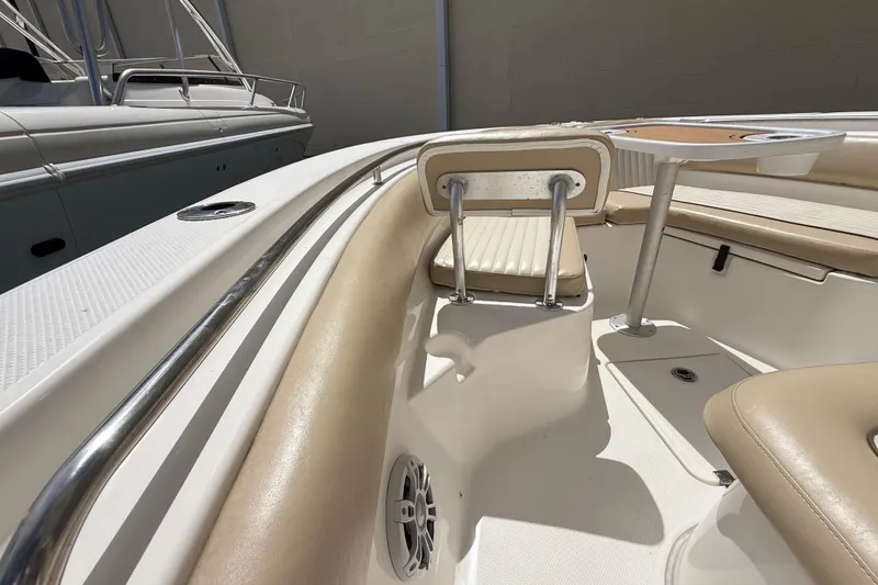 Slide: The Image of 2016 Sea Fox 226 Commander boat interior with beige seating and table. - 36