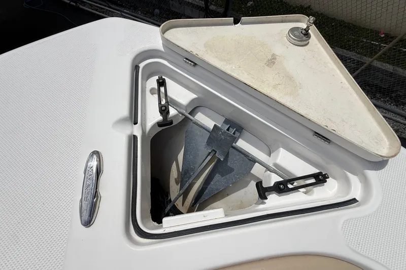 Slide: The Image of Anchor compartment of 2016 Sea Fox 226 Commander boat, featuring secure storage and latch. - 39