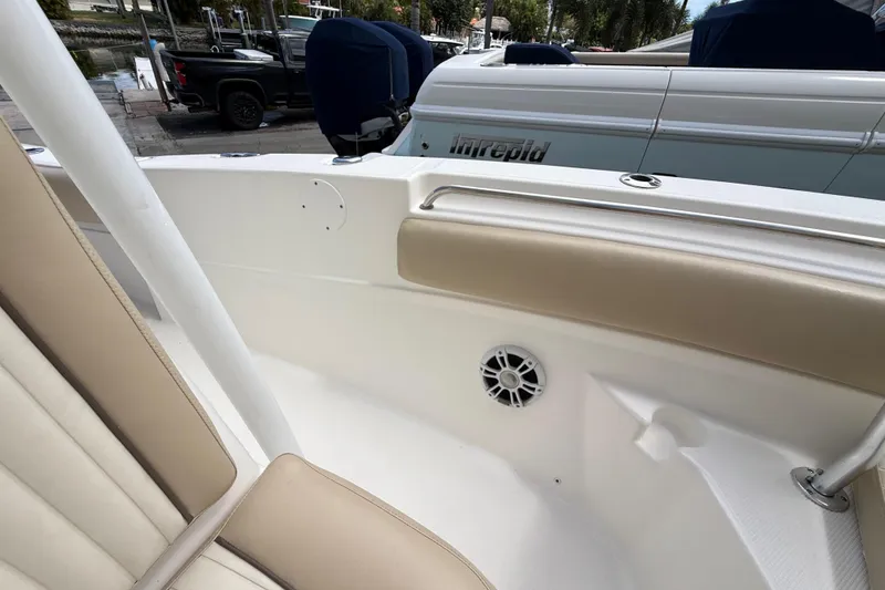 Slide: The Image of 2016 Sea Fox 226 Commander boat interior with beige seating and speaker detail. - 41