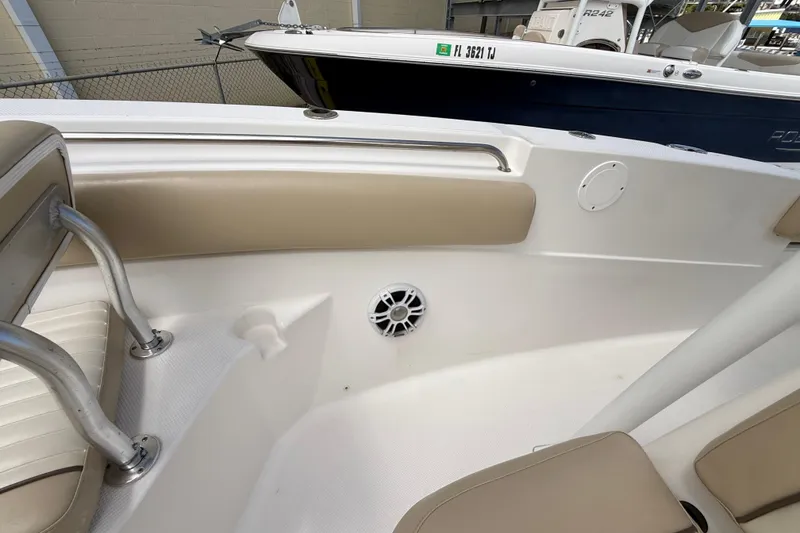 Slide: The Image of 2016 Sea Fox 226 Commander boat interior with beige seating and stainless steel railings. - 42