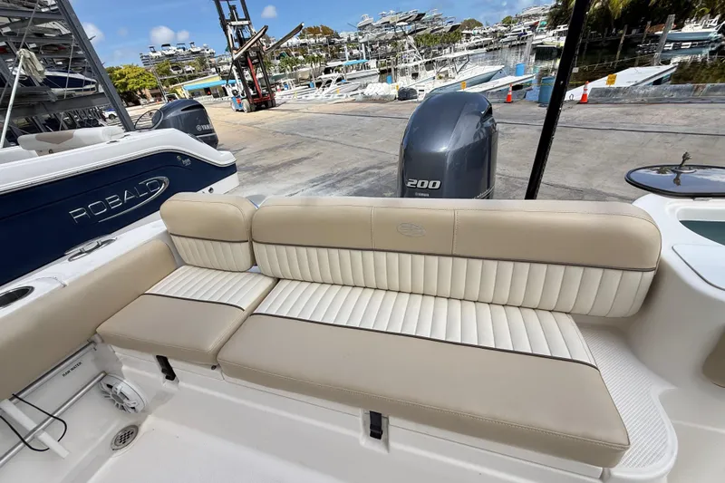 Slide: The Image of 2016 Sea Fox 226 Commander boat interior with cushioned seating and Yamaha engine. - 44