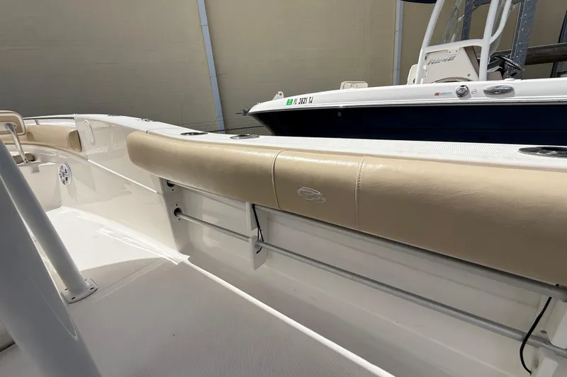 Slide: The Image of 2016 Sea Fox 226 Commander boat interior with beige seating and white deck. - 45