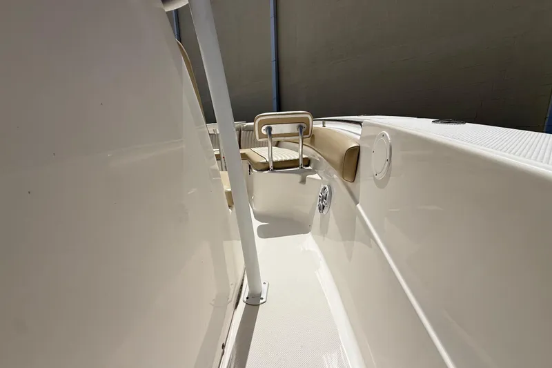 Slide: The Image of 2016 Sea Fox 226 Commander boat interior with beige seating and white deck. - 47