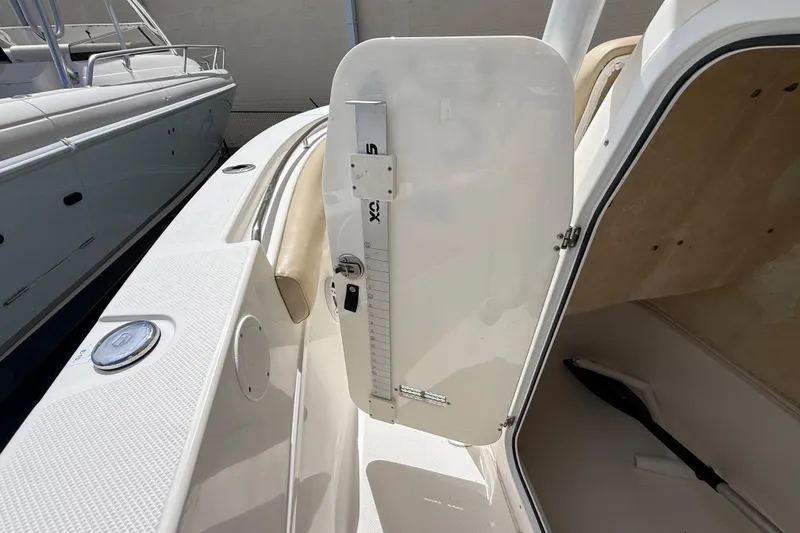 Slide: The Image of 2016 Sea Fox 226 Commander boat interior with open storage compartment and visible seating. - 48
