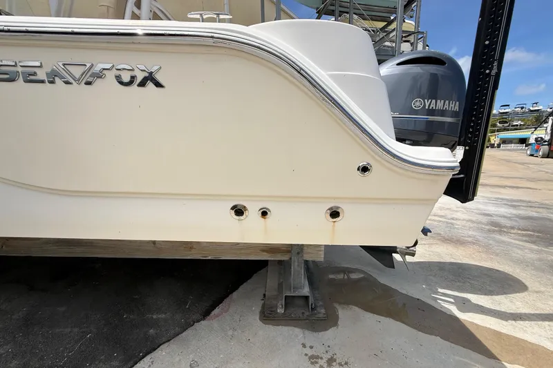 Slide: The Image of 2016 Sea Fox 226 Commander boat with Yamaha engine on a stand. - 5