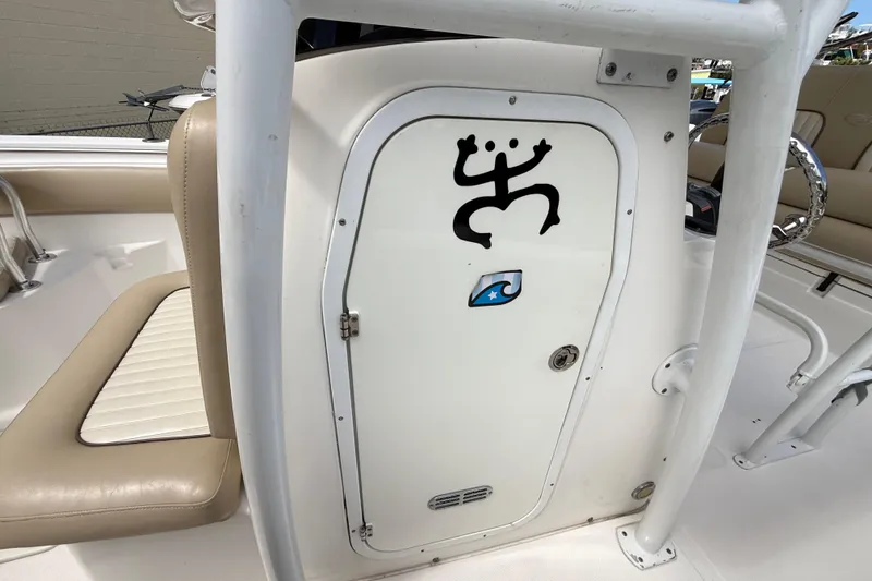 Slide: The Image of 2016 Sea Fox 226 Commander boat interior with unique door design and beige seating. - 50