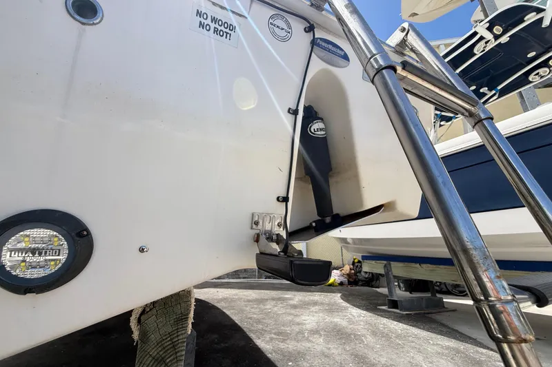 Slide: The Image of 2016 Sea Fox 226 Commander boat stern with ladder and trim tab detail. - 51