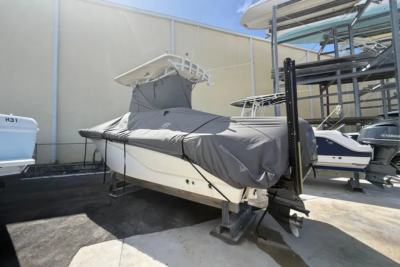 Slide: The Image of 2016 Sea Fox 226 Commander boat covered and stored on a rack in a marina. - 9