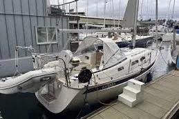 Slide: The Image of 2020 Hallberg Rassy 310 yacht docked at marina, featuring sleek design and modern amenities. - 1