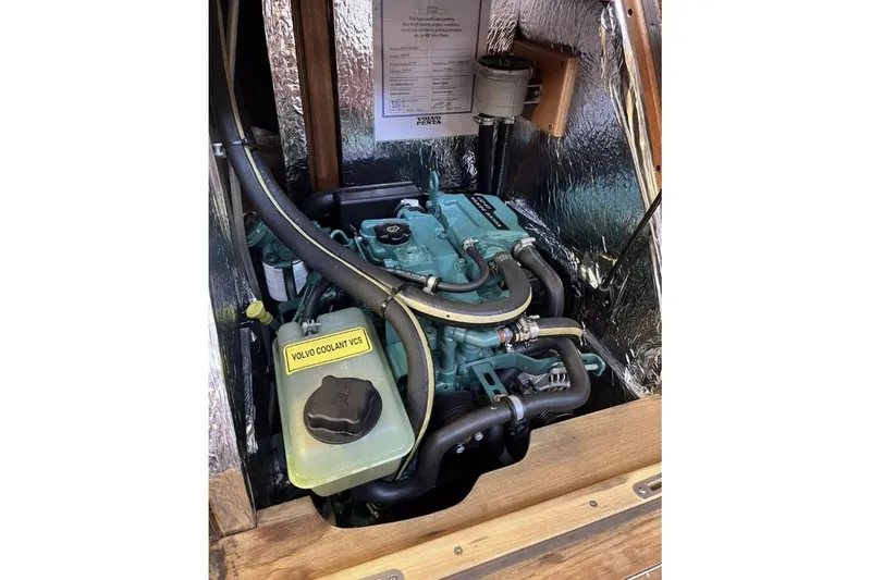 Slide: The Image of Engine compartment of a 2020 Hallberg Rassy 310 sailboat with Volvo Penta engine. - 13