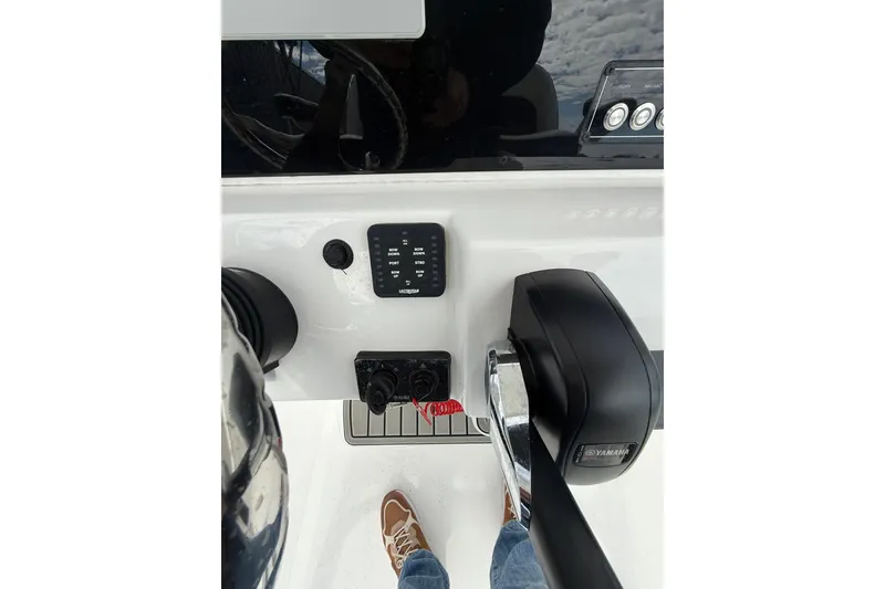 Slide: The Image of Control panel of 2025 Tidewater 198 CC Adventure boat with Yamaha throttle. - 14