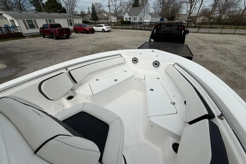 Slide: The Image of 2025 Tidewater 198 CC Adventure boat interior with seating and storage compartments. - 16