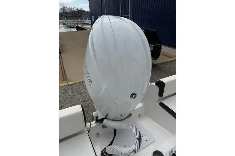 Slide: The Image of 2025 Tidewater 198 CC Adventure boat with Yamaha outboard motor at dockside. - 9