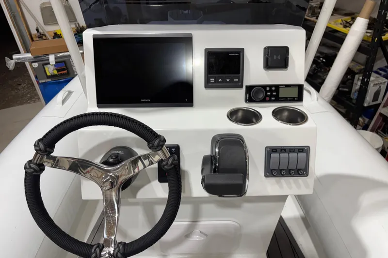 Slide: The Image of Steering console of 2026 Airrib 18 boat with modern controls and navigation display. - 3