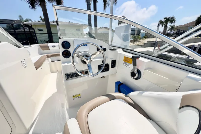 Slide: The Image of Interior view of 2013 Key West 203 DFS boat cockpit with steering wheel and controls. - 7