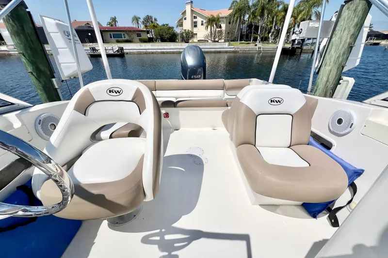 Slide: The Image of 2013 Key West 203 DFS boat interior with comfortable seating and scenic waterfront view. - 8