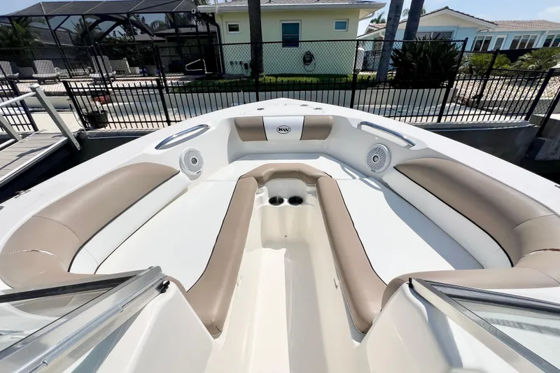Slide: The Image of 2013 Key West 203 DFS boat interior with beige seating and cup holders. - 9