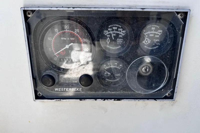 Slide: The Image of Control panel of a 1986 Pacific Seacraft 34 sailboat with Westerbeke gauges. - 21