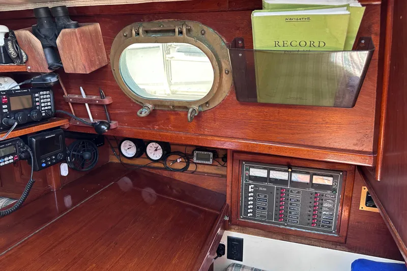 Slide: The Image of Navigation station of a 1986 Pacific Seacraft 34 sailboat with instruments and porthole. - 24