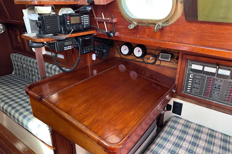 Slide: The Image of Navigation station on a 1986 Pacific Seacraft 34 sailboat with communication equipment. - 26