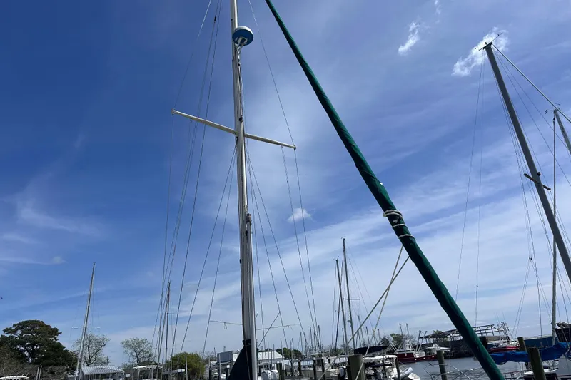 Slide: The Image of Sailboat mast of 1986 Pacific Seacraft 34 against a clear blue sky. - 3