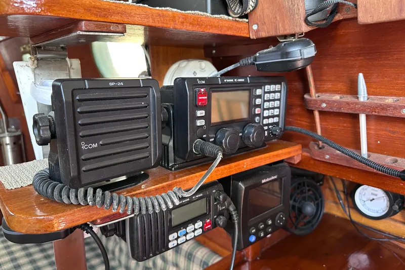 Slide: The Image of Navigation equipment on a 1986 Pacific Seacraft 34 sailboat, featuring Icom radio systems. - 40