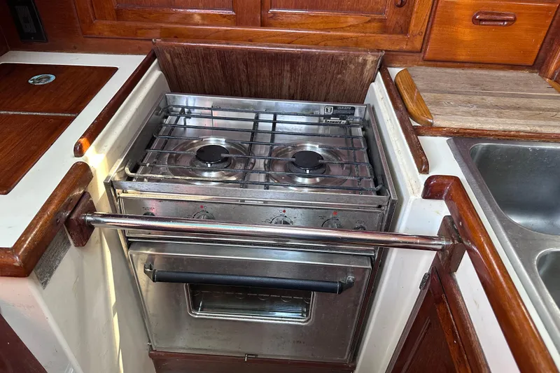 Slide: The Image of Galley kitchen in 1986 Pacific Seacraft 34 sailboat with stove and sink. - 43