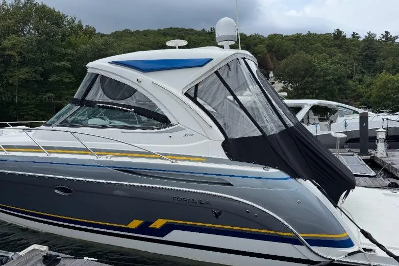 Slide: The Image of 2019 Formula 37 Performance Cruiser docked, featuring sleek design and vibrant accents. - 12