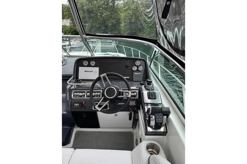 Slide: The Image of Helm of 2019 Formula 37 Performance Cruiser with modern controls and navigation equipment. - 14
