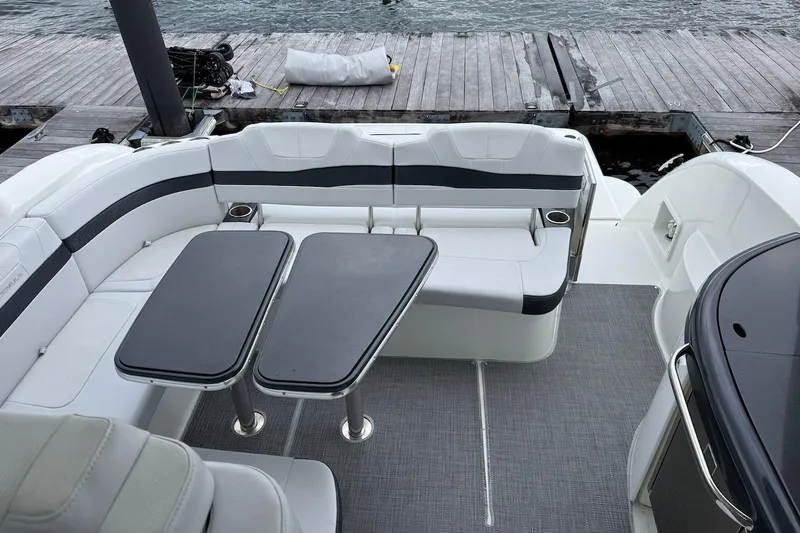 Slide: The Image of 2019 Formula 37 Performance Cruiser interior with sleek seating and dual tables by the dock. - 20