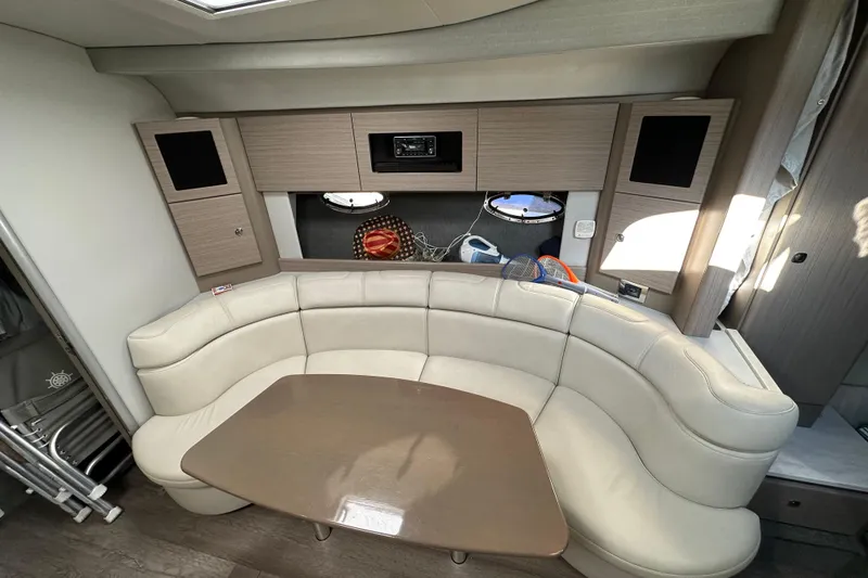 Slide: The Image of Interior of 2019 Formula 37 Performance Cruiser with curved seating and wooden table. - 24