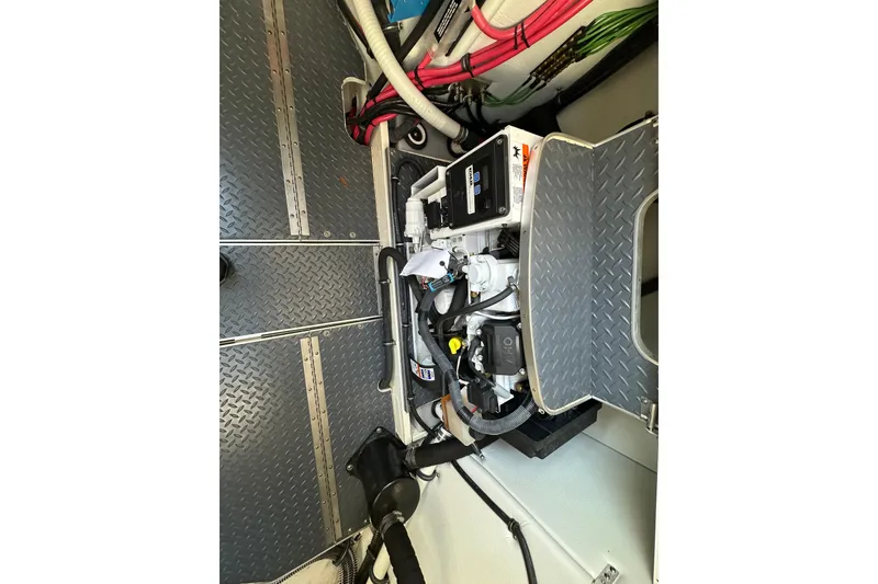 Slide: The Image of Engine compartment of a 2019 Formula 37 Performance Cruiser with visible wiring and components. - 29
