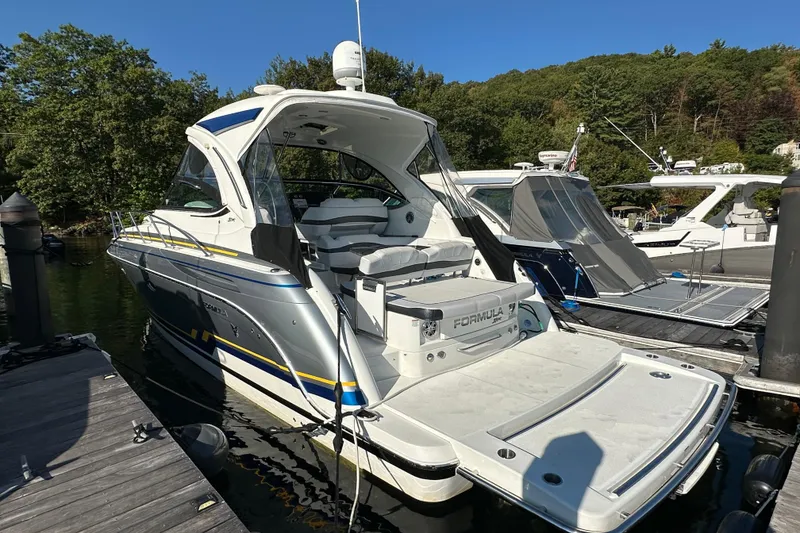 Slide: The Image of 2019 Formula 37 Performance Cruiser docked, showcasing sleek design and modern features. - 4