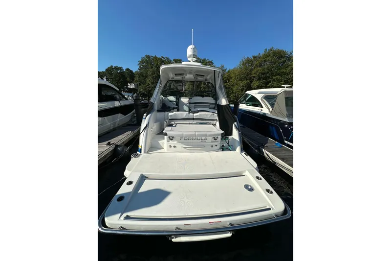 Slide: The Image of 2019 Formula 37 Performance Cruiser docked, showcasing spacious deck and sleek design. - 5