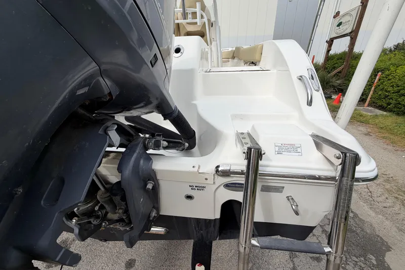 Slide: The Image of 2015 Sea Fox 266 Commander boat stern with motor and swim ladder. - 12