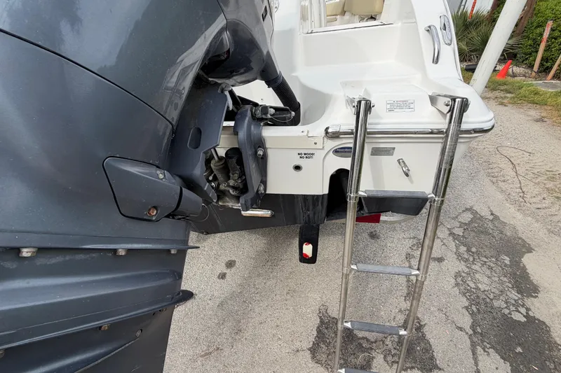 Slide: The Image of Rear view of a 2015 Sea Fox 266 Commander boat with motor and ladder. - 13