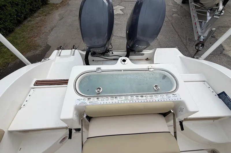 Slide: The Image of Rear view of a 2015 Sea Fox 266 Commander with dual outboard engines. - 17