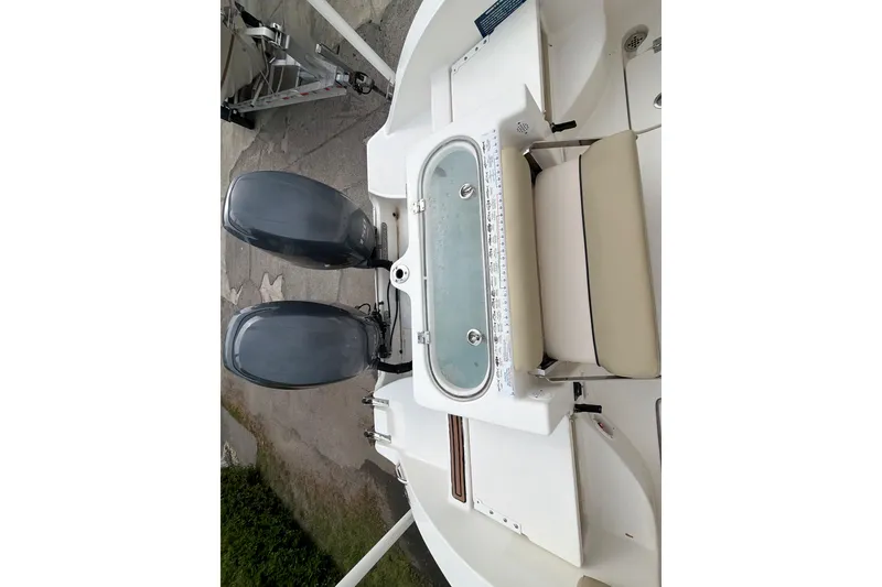 Slide: The Image of 2015 Sea Fox 266 Commander boat with dual engines and seating area. - 18