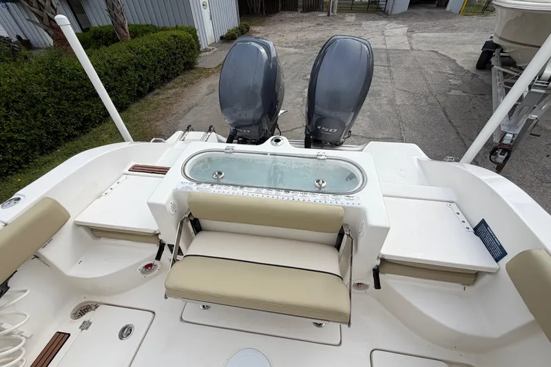 Slide: The Image of 2015 Sea Fox 266 Commander boat with dual engines and seating area. - 19