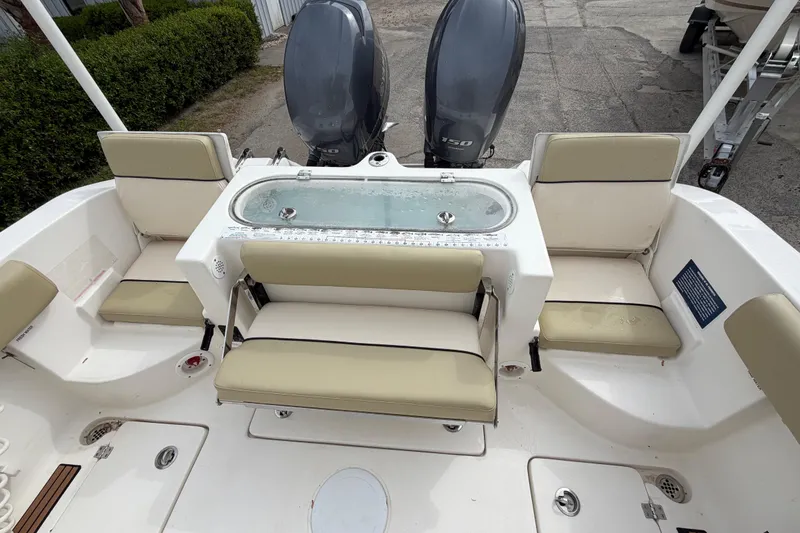 Slide: The Image of 2015 Sea Fox 266 Commander boat interior with seating and dual engines. - 20