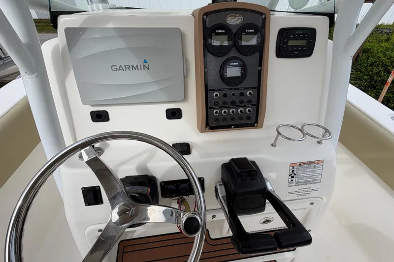 Slide: The Image of 2015 Sea Fox 266 Commander boat dashboard with Garmin navigation system and controls. - 21