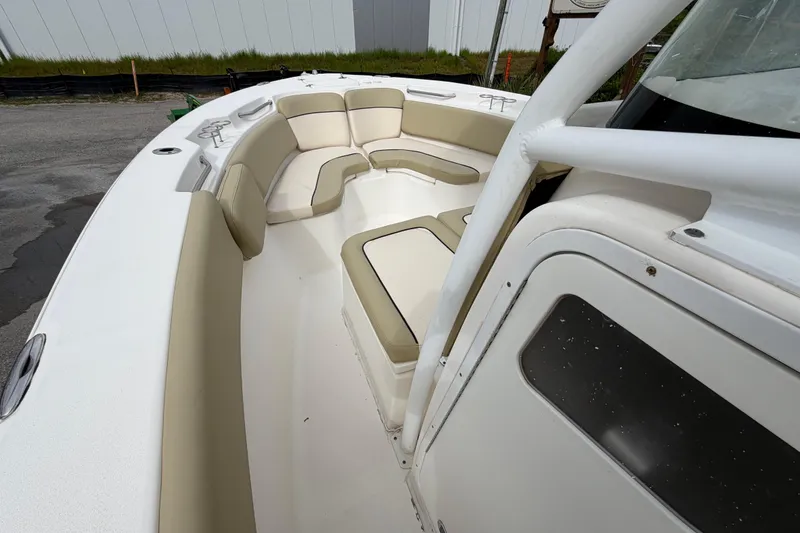 Slide: The Image of 2015 Sea Fox 266 Commander boat interior with cushioned seating and white finish. - 23