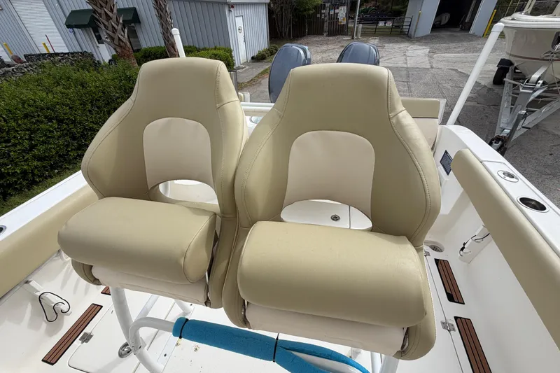 Slide: The Image of Two beige captain's chairs on a 2015 Sea Fox 266 Commander boat. - 24
