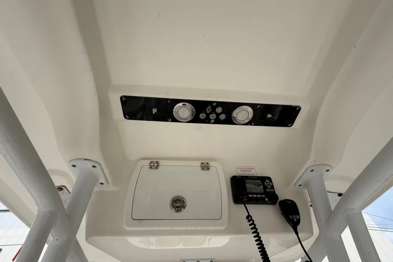 Slide: The Image of 2015 Sea Fox 266 Commander boat console with gauges and radio equipment. - 26