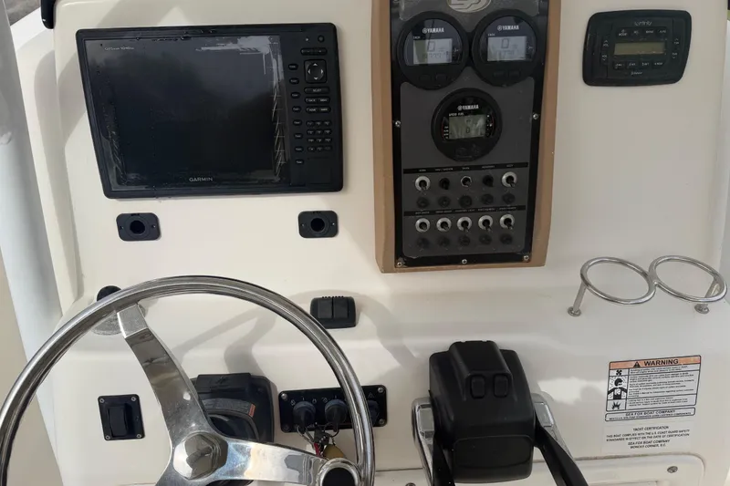 Slide: The Image of Control panel of a 2015 Sea Fox 266 Commander boat with Garmin navigation system. - 27