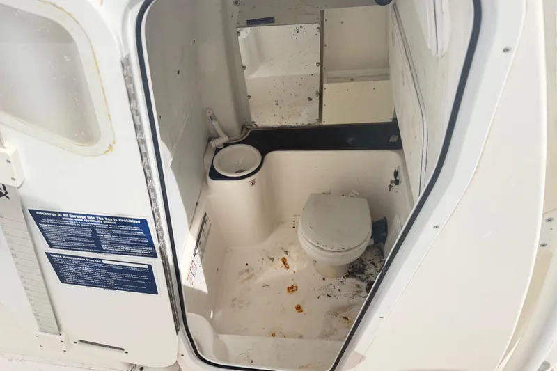 Slide: The Image of Interior of a 2015 Sea Fox 266 Commander boat's compact bathroom. - 28