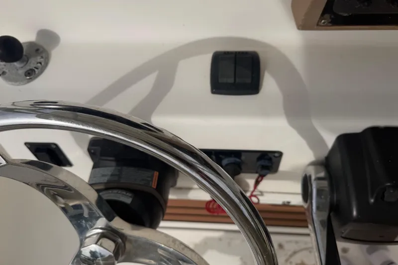 Slide: The Image of Close-up of 2015 Sea Fox 266 Commander boat controls and steering wheel. - 30