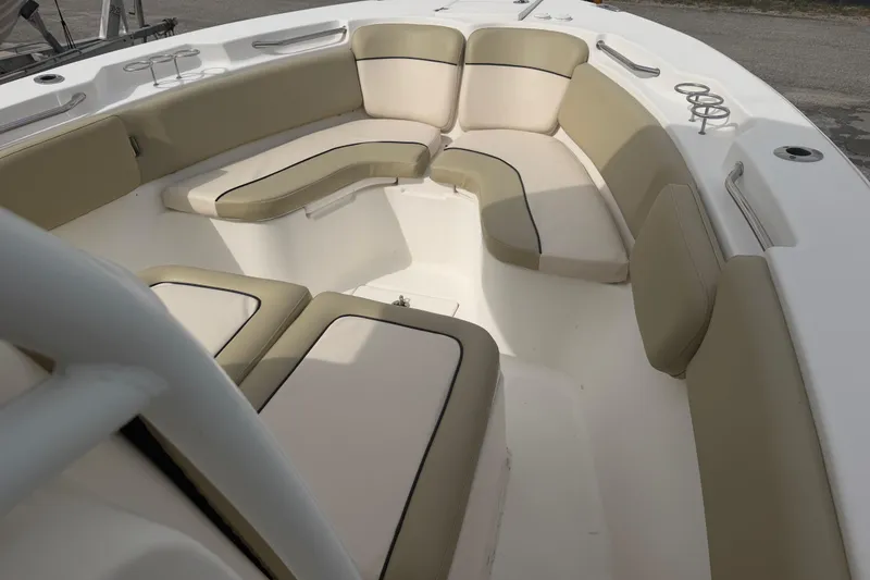 Slide: The Image of 2015 Sea Fox 266 Commander boat interior with beige seating and cup holders. - 33