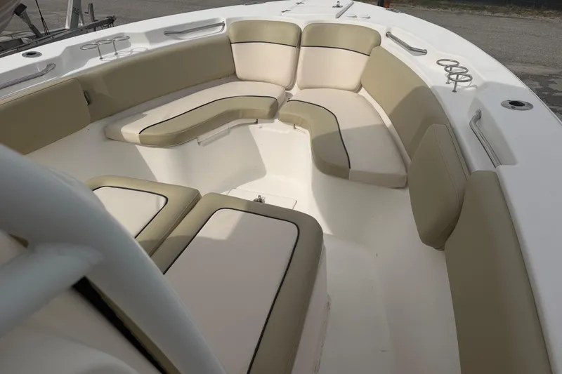 Slide: The Image of 2015 Sea Fox 266 Commander boat interior with beige seating and cup holders. - 34
