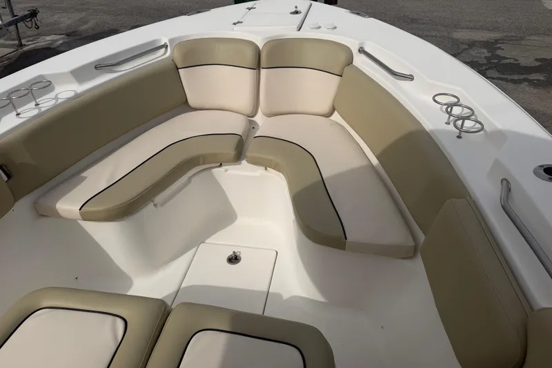 Slide: The Image of 2015 Sea Fox 266 Commander boat interior with beige seating and cup holders. - 35